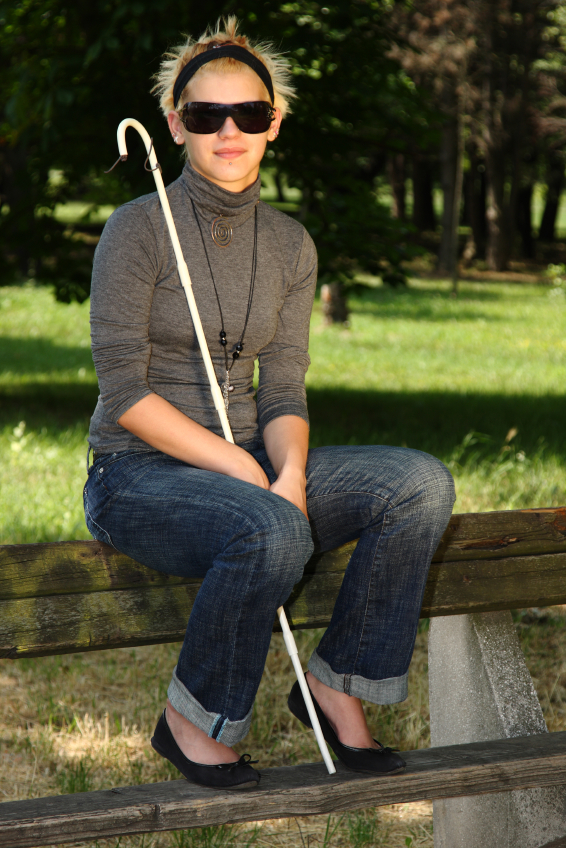 Young Woman with Dark Glasses and a Cane