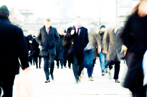 People on a city street walking to work