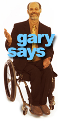 Gary Karp in his wheelchair gesturing with a smile