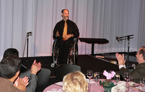 Gary Karp being applauded while onstage